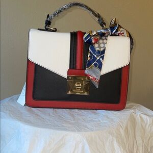 Elegant Black and White Handbag with Red Accents